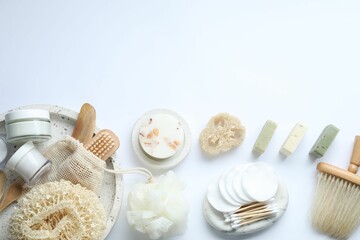 Bath accessories. Flat lay composition with personal care products on white background, space for text