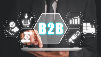 B2B, Business to business concept, Businessman using tablet with b2b icon on virtual screen.