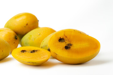 Naklejka na ściany i meble ripe juicy mangoes are infected by fruit beetles pest, isolated on white background