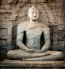 Ancient Rock Buddha Statue Amidst Sri Lanka's Historic Temples