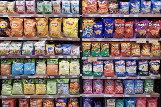 PENANG, MALAYSIA - 1 DEC 2023: 
Jaya Grocer, the premium supermarket in Malaysia, proudly displays a diverse array of flavored chips and snacks on its store shelves.