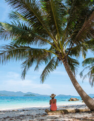 Koh Wai Island Thailand tropical Island near Koh Chang, couple of men and woman on the beach