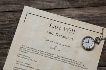 Last Will and Testament with pocket watch on wooden table, top view