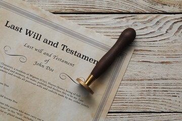 Last Will and Testament with wax stamp on wooden table, top view