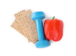 Healthy diet. Crispbreads, bell pepper and dumbbell isolated on white, top view