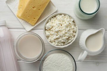 Lactose free dairy products on white wooden table, flat lay