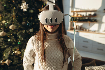 Surrounded by sunshine on a winter morning, a lively young woman wears a VR headset.