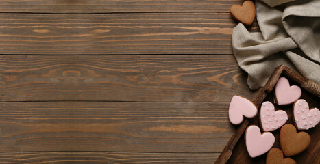 Tray with tasty heart shaped cookies on wooden background with space for text. Valentine's Day...