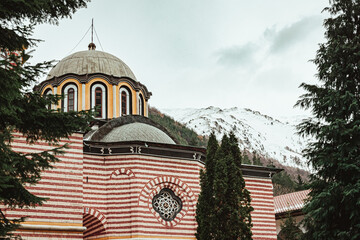 Rila Monastery with snowy mountains 