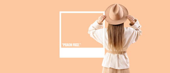 Beautiful fashionable young woman in hat and knitted sweater on beige background, back view