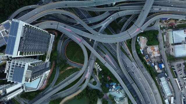 Aerial view of the expressway in Malaysia in the city of Kuala Lumpur, Penchala link. A birds eye view of a confusing traffic intersection. Architecture and urban planning of the capital.