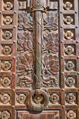 Ornate Bronze Door Detail with Lotus Motifs and Knocker