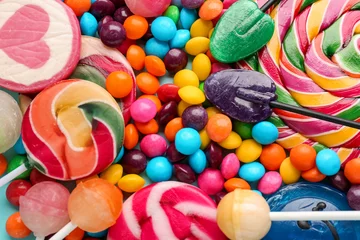 Gordijnen Sweet lollipops and candies as background, closeup © Pixel-Shot