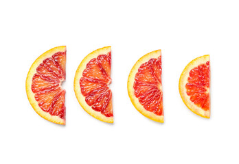 Tasty slices of blood orange fruit on white background