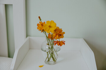 bouquet of yellow and orange poppies in vase