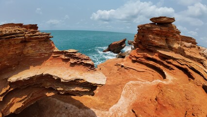 Fototapeta na wymiar Red rocks and beautiful ocean