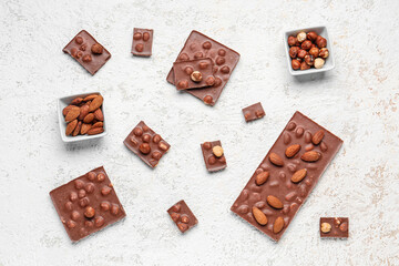 Sweet tasty chocolate with nuts on  light background
