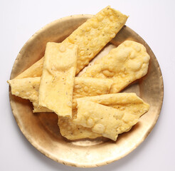 fafda Gathiya (fafda jalebi) is a very popular Gujarati snack, white bowl pouch packing common street snack from India.