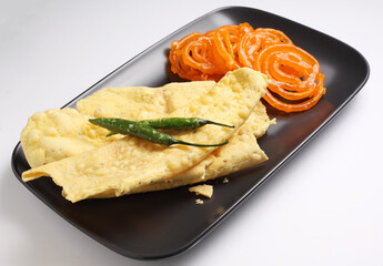 Popular Indian sweet Jalebi and Fafda served with Sambhara. Gujarati snack is mostly eaten during Indian Festivals such as, Gudi Padwa, Dussehra, Eid, Diwali, Mahashivratri, Holi