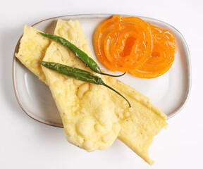 Popular Indian sweet Jalebi and Fafda served with Sambhara. Gujarati snack is mostly eaten during Indian Festivals such as, Gudi Padwa, Dussehra, Eid, Diwali, Mahashivratri, Holi