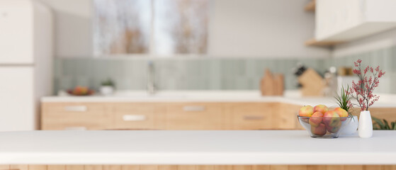 Copy space on a white kitchen tabletop in a modern white and clean kitchen.