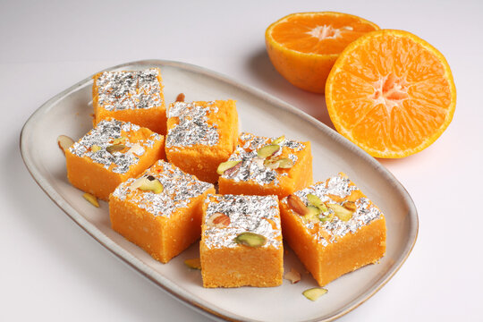slices of orangeNagpur Orange Burfee or barfi or burfi is a creamy fudge made with fresh oranges and mawa