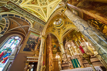 Fototapeta na wymiar Majestic Cathedral Interior with Ornate Ceiling and Altar, Low Angle View
