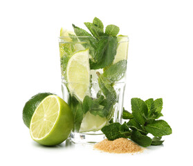 Glass of tasty mojito and ingredients on white background