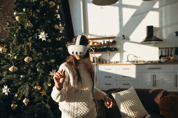 The image portrays a stunning girl in a virtual reality headset against the backdrop of a Christmas tree.