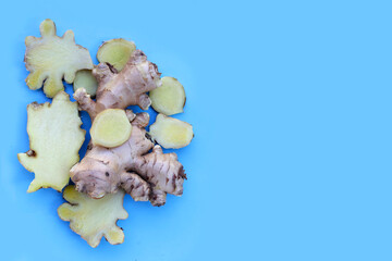 Fototapeta premium Fresh ginger on blue background.