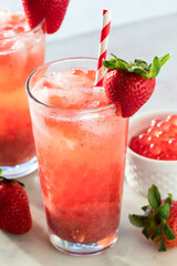 Refreshing homemade strawberry lemonade with bubble pearls, ready for drinking.