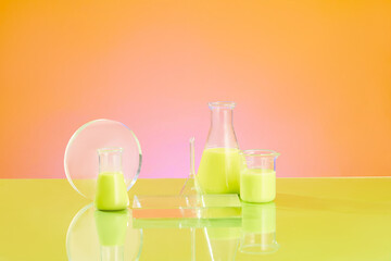 Front view of lab glassware containing green solution decorated with transparent podiums on a color gradient background. Space for product presentation, text and design. Minimal laboratory concept