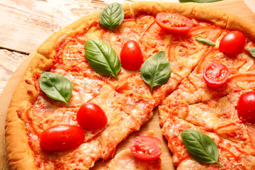 Board with tasty pizza margarita, closeup