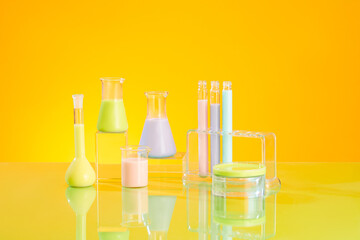 Vertical frame with lab equipments - erlenmeyer flasks, beaker, test tube and petri dish filled...