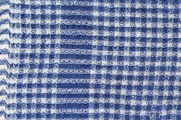 Blue and white checked pattern cloth fabric textured close up background