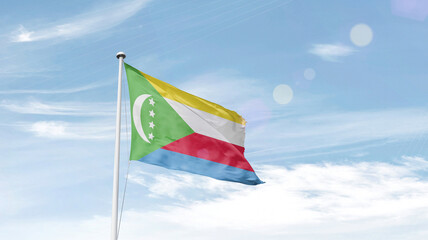 Comoros national flag cloth fabric waving on the sky - Image