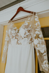 Wedding Dress hanging outside of a home