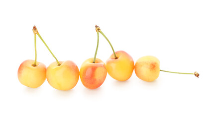 Many sweet yellow cherries on white background