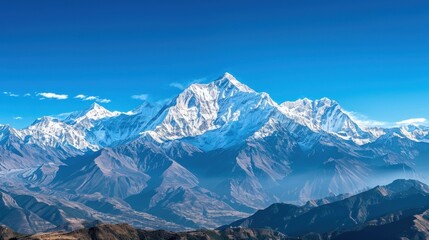 Obraz premium Snow-capped mountains with a clear blue sky