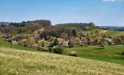 Hill going down to small German village in Rhineland Palatinate on a spring day.