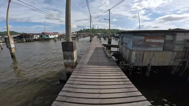 Floating village  Kampong Ayer. Bandar Seri Begawan in Brunei is a beautiful and harmonious Asian nation, situated on the northern coast of Borneo in the South China Sea. The purest air, immaculate co