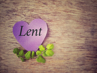 Lent Season, Holy Week and Good Friday concepts - Lent text on purple heart shape paper with flora...