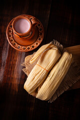 Tamales. hispanic dish typical of Mexico and some Latin American countries. Corn dough wrapped in...