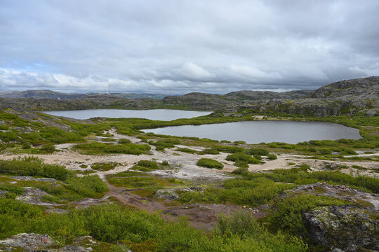 Northern landscape with a lakes and tundra surrounded by hills on the Kola Peninsula