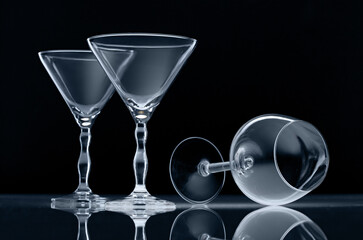 Three empty wine glasses isolated on black background - 706159405