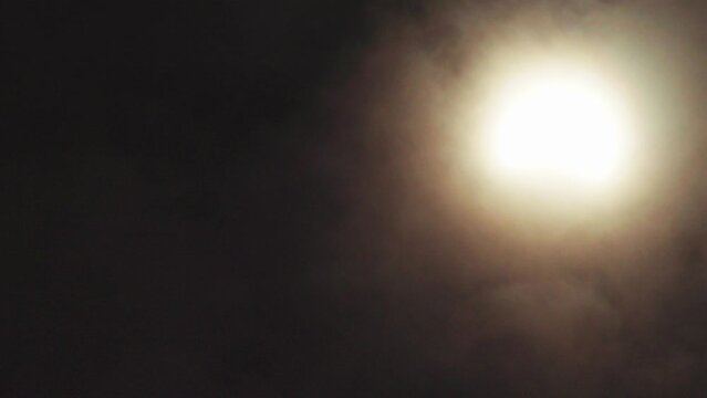 Partial solar eclipse with clouds 2