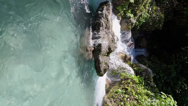 Rio San Rafael, vertical dolly forward to scenic exotic waterfall, summer