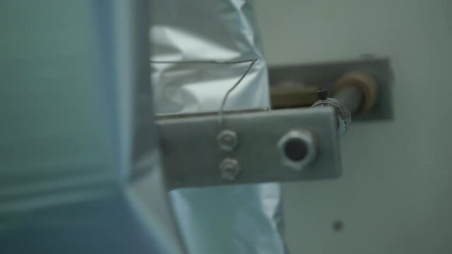 close up view of the press machine in the factory