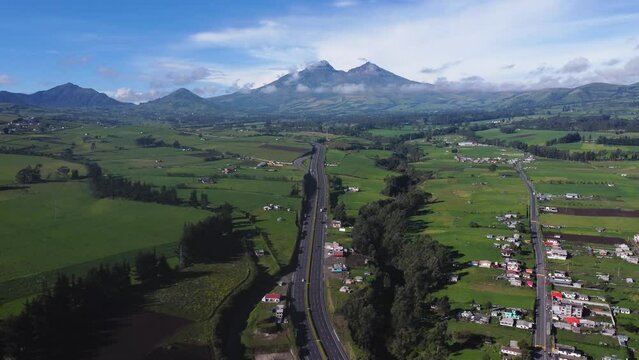 Illinizasa volcano peak from Panamericana highway E-35 Chaupi Ecuador drone view