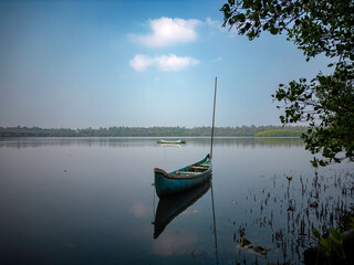 Boat on Tranquil Lake Amid Lush Foliage